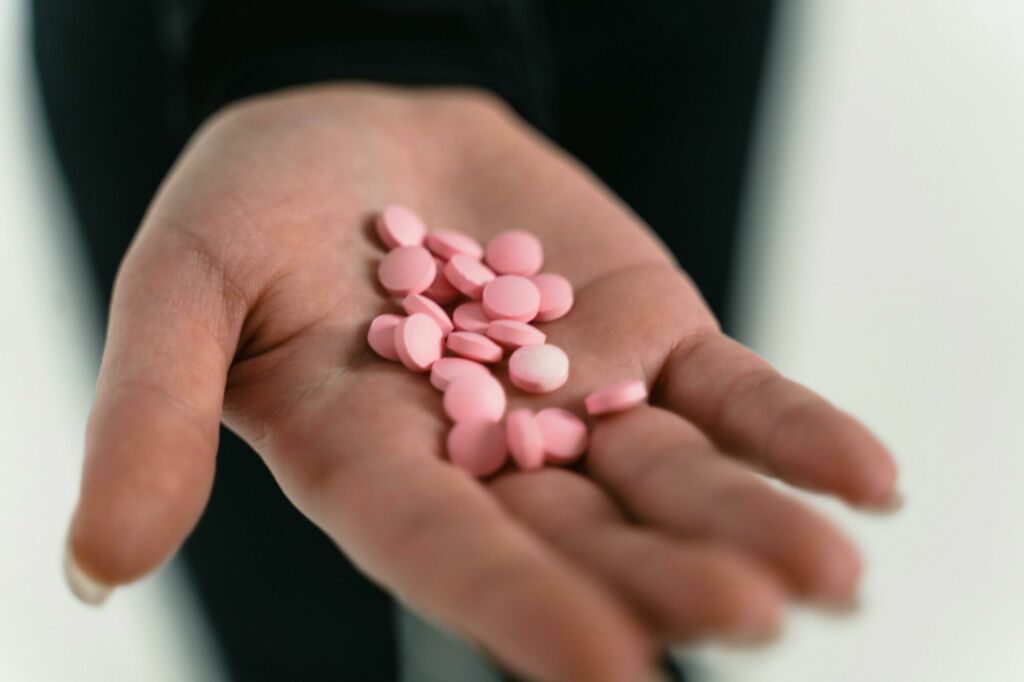 Close-Up Shot of a Person Holding Medicines